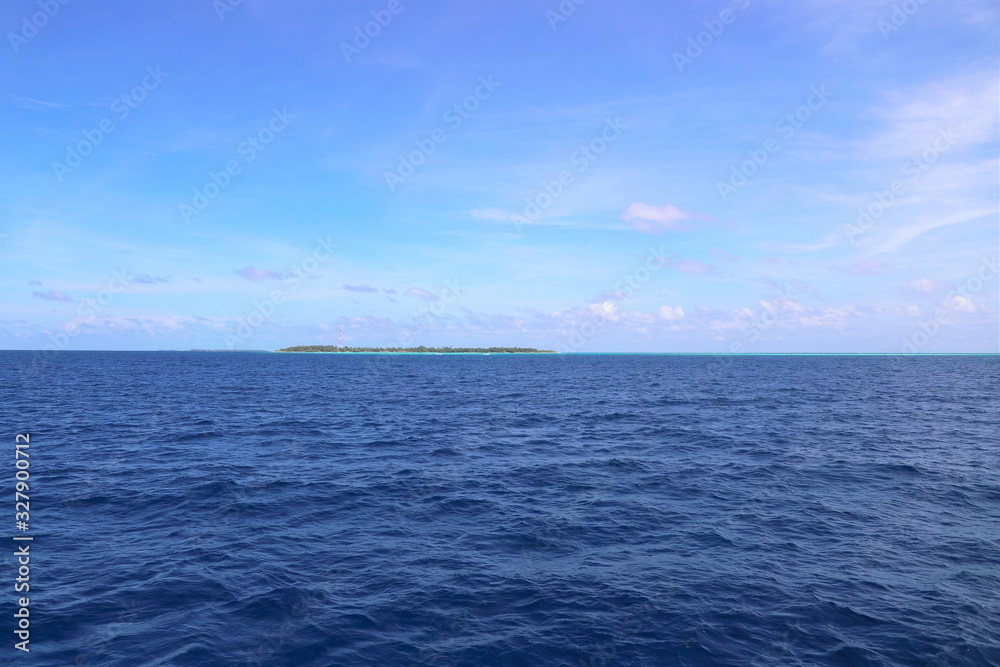  Sea, blue sky and small maldives islands