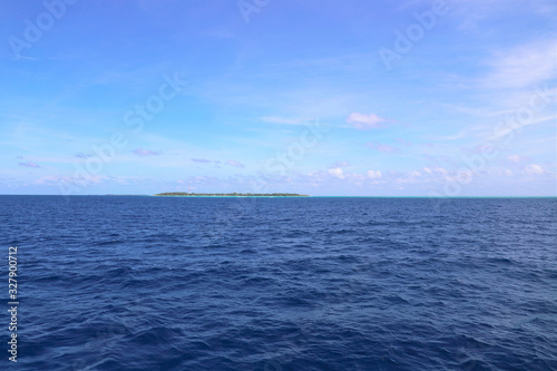  Sea, blue sky and small maldives islands