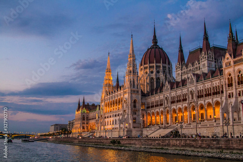 The Hungarian Parliament Building in the evening. The Danube river. The Margit bridge. Twilight sky. Backlight. Budapest, Hungary.