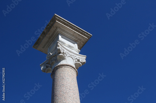 Granite column with capital in Roman Composite style against blue sky