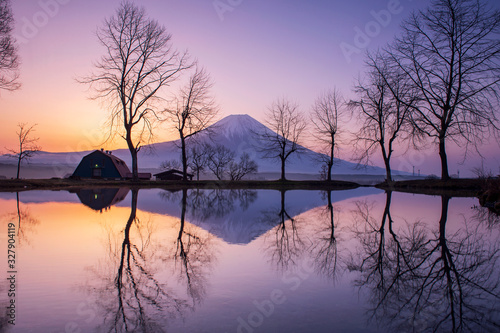 Close up top of beautiful Fuji mountain with snow cover on the top with could, Beautiful scenic landscape of mountain Fuji or Fujisan on during sunset, Japan