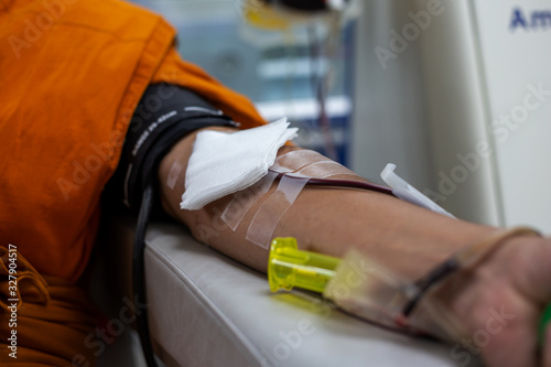 Blood donors are donating blood on the bed