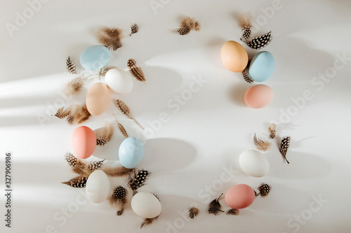 Foto Natural Colored brown, quail and white Eggs with sunlights