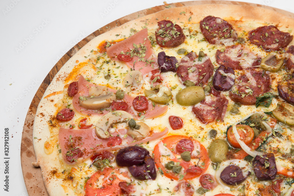 Salami pizza with mushrooms, onions, green olives and tomato with white background Salami pizza with mushrooms, onions, green olives and tomato with white background
