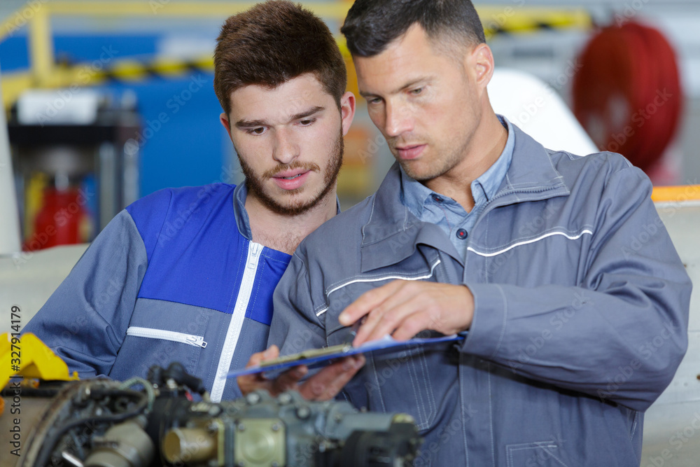 aircraft mechanic and his apprentice