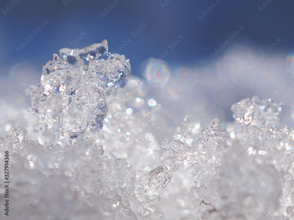 Melting snow in early spring in March. The beginning of the warm season, the end of winter. Sunny bright day. Macro Melting snow in early spring in March. The beginning of the warm season, the end of winter. Sunny bright day. Macro