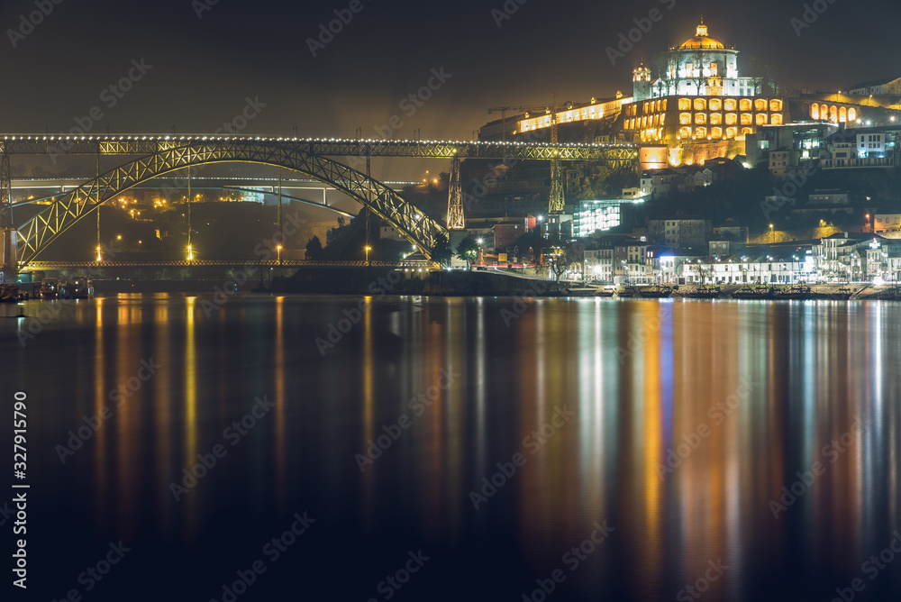 Fototapeta premium Night View of Monastery of Serra do Pilar and Luis I Bridge in Vila Nova de Gaia, Portugal