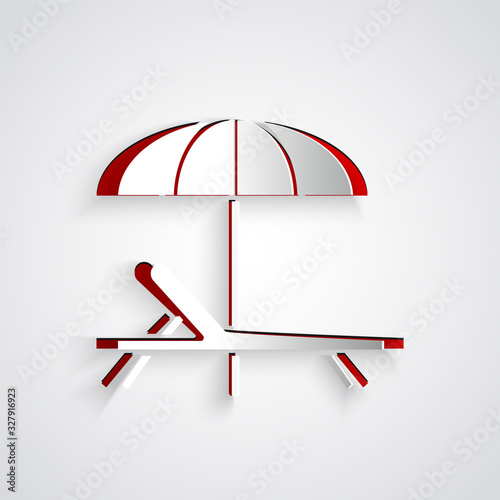 Paper cut Sunbed icon isolated on grey background. Beach umbrella and Sun lounger. Paper art style. Vector Illustration