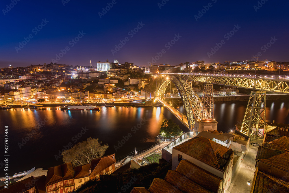 Night View of Arched Luis I Bridge Carrying Low Level Road and a High Level Metro Line Between Porto and Vila Nova de Gaia Cities in Portugal