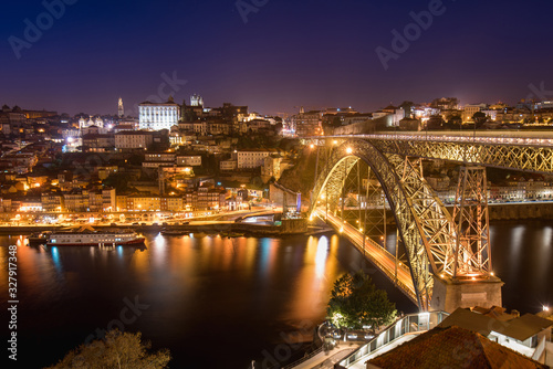 Night View of Arched Luis I Bridge Carrying Low Level Road and a High Level Metro Line Between Porto and Vila Nova de Gaia Cities in Portugal © Donatas Dabravolskas