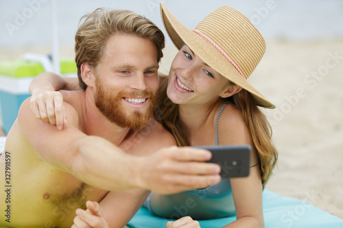 happy couple selfie on beach vacation