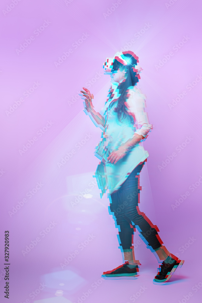 Fototapeta premium Woman is using virtual reality headset. Image with glitch effect.