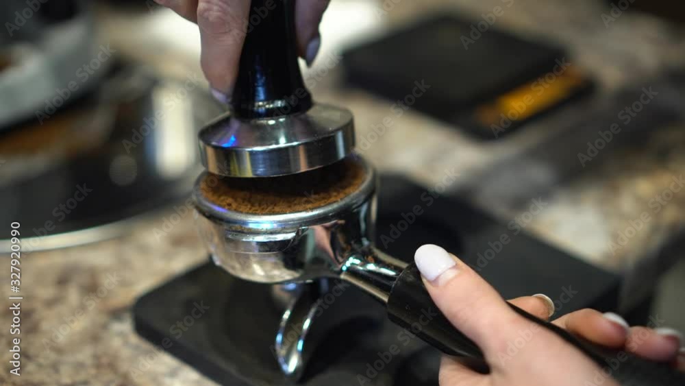 Barista Making Fresh coffee espresso machine. Ground coffee chop on
