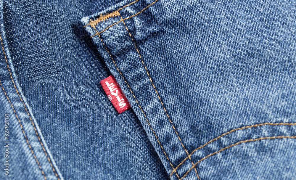 flour Pogo stick jump pivot Levis red tag on denim, jeans texture. Levi Strauss is an american clothing  company. Moscow, Russia - December 23, 2019 Stock Photo | Adobe Stock