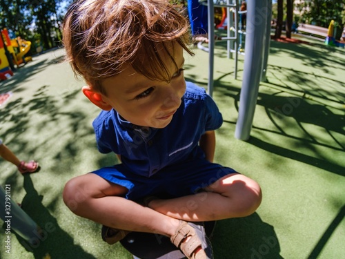 Happy boy on playground, su...