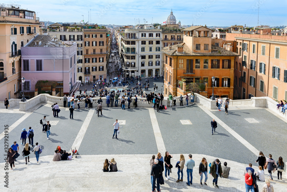 Obraz premium The Spanish Steps in Rome lead from Spanish Square to the Trinita dei Montina Church on top of Pincho Hill. At the foot of the Spanish Steps is the square with the fountain
