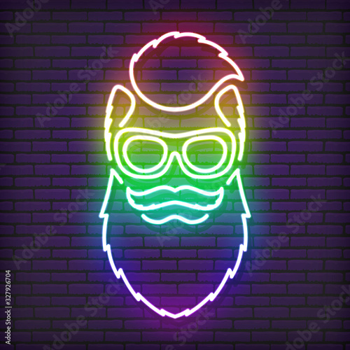 A neon sign in the form of a hipster with a beard, glasses and an iroquois. Shimmering all the colors of the rainbow. Against the background of a brick wall, with a shadow.