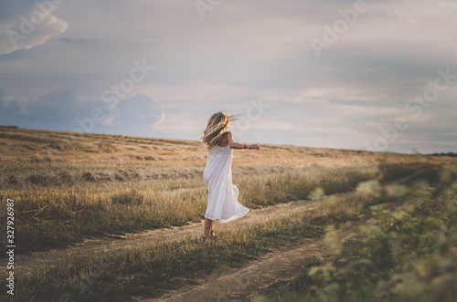 expressive wild dance in sunset time in romantic countryside
