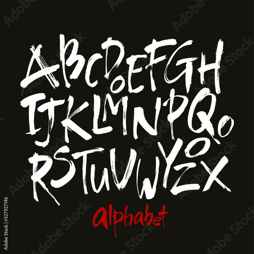 Vector Acrylic Brush Style Hand Drawn Alphabet Font. Calligraphy alphabet on a black background. Ink hand lettering.