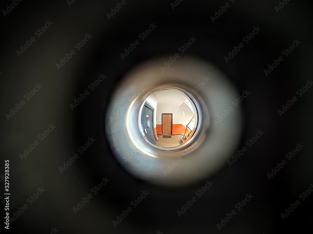 View to the hall through peephole eyelet in the door. Slovakia