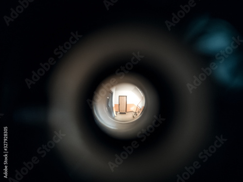 View to the hall through peephole eyelet in the door. Slovakia
