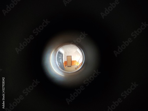 View to the hall through peephole eyelet in the door. Slovakia