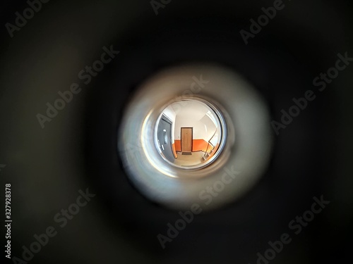 View to the hall through peephole eyelet in the door. Slovakia photo