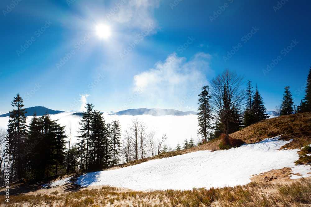 Thick white fog among mountain peaks Thick white fog among mountain peaks