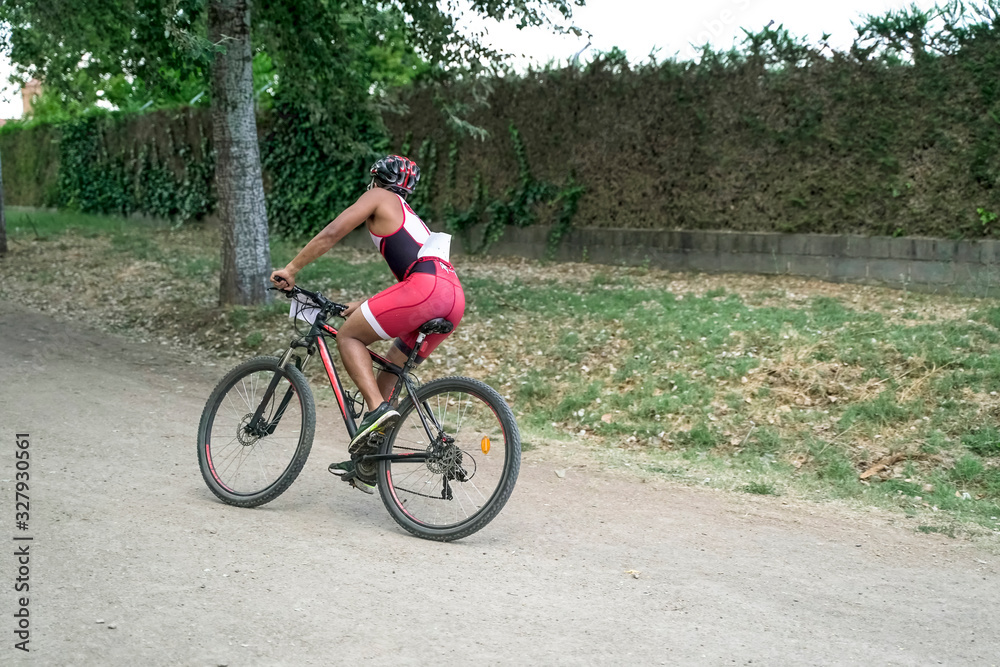 Mountain biker on bike trails, MTB cyclist man on rural road. Sports motivation and inspiration. Mountain biker on bike trails, MTB cyclist man on rural road. Sports motivation and inspiration.