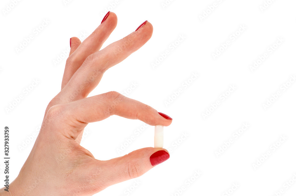 Pills in woman hand isolated on white background Pills in woman hand isolated on white background
