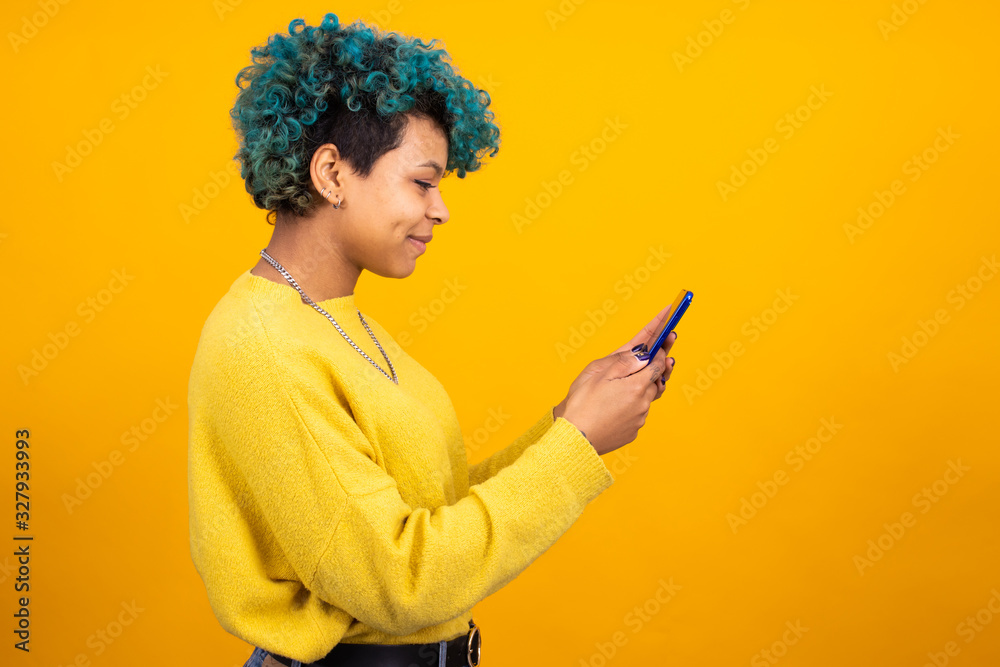 girl or woman looking at mobile phone isolated in color background girl or woman looking at mobile phone isolated in color background