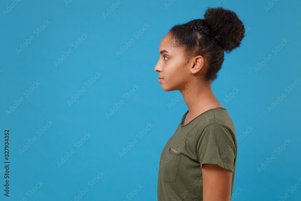 Side view portrait of a young athletic woman looking at camera over pink  background Royalty-Free Stock Image - Storyblocks