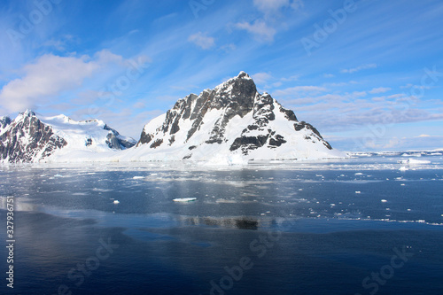 Landscape of snowy mountains and icy shores of the Lemaire Channel in the Antarctic Peninsula, Antarctica © Marco Ramerini