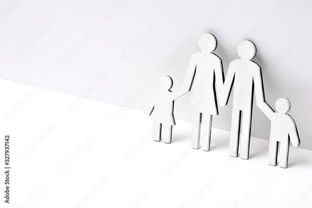 Happy family of wooden figures on a white background