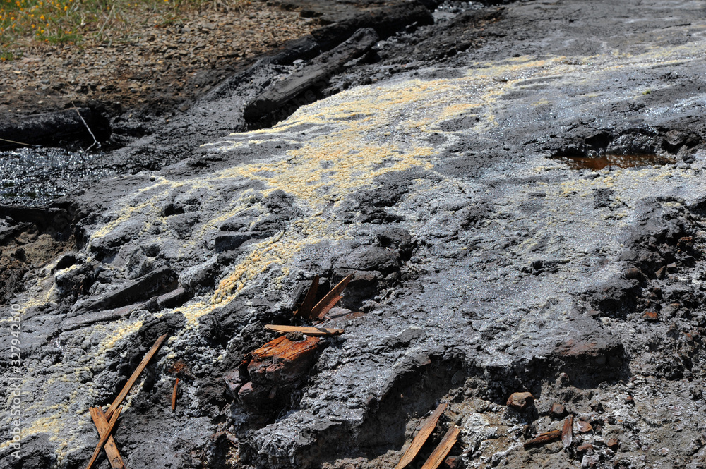Active mud (clay and bitumen) volcano on the outskirts of the village Starunja in Carpathian. Spills of crude oil on the soil surface. Crater of the mud volcano. Active mud (clay and bitumen) volcano on the outskirts of the village Starunja in Carpathian. Spills of crude oil on the soil surface. Crater of the mud volcano.