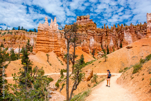 hiker on the navajo loop trail in the bryce canyon national park in summer