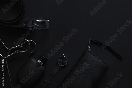 Accessories for women's beauty on a monochromatic background. Perfume , hanger, Shoes, wallet and leather bag. Minimalist black trend 2020 and luxury background. Top view Flatlay