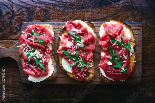 Italian sandwiches with mozzarella and beef carpaccio top view