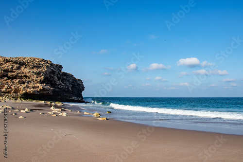 Beach Ras al jinz between rocks in Oman photo