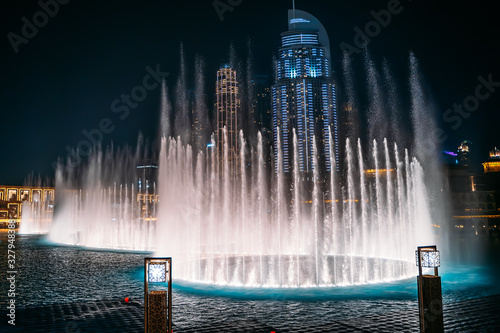 Dubai fountain with illumination at night. Popular tourist place, UAE.