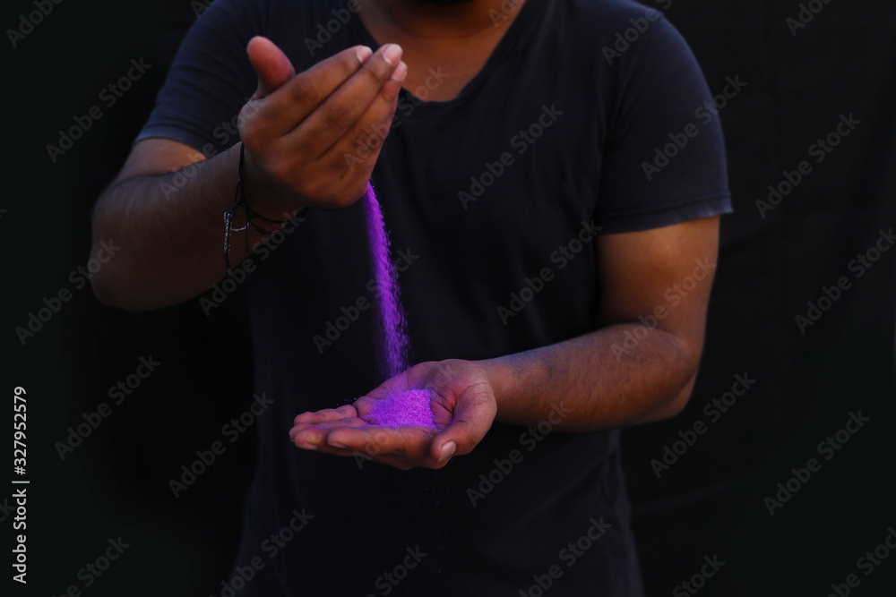 cropped view of hands with holi powder for Hindu spring festival of colours