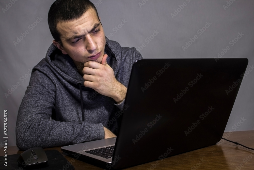 worker is sitting in front of laptop worker is sitting in front of laptop