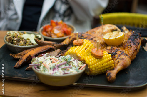 Chicken and corn with a side of cold slaw