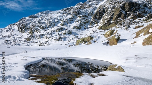 Beautiful shot of snowy mountains in PeÃ±alara, Spain photo