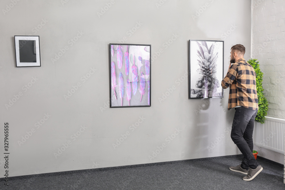 Man at exhibition in modern art gallery Man at exhibition in modern art gallery