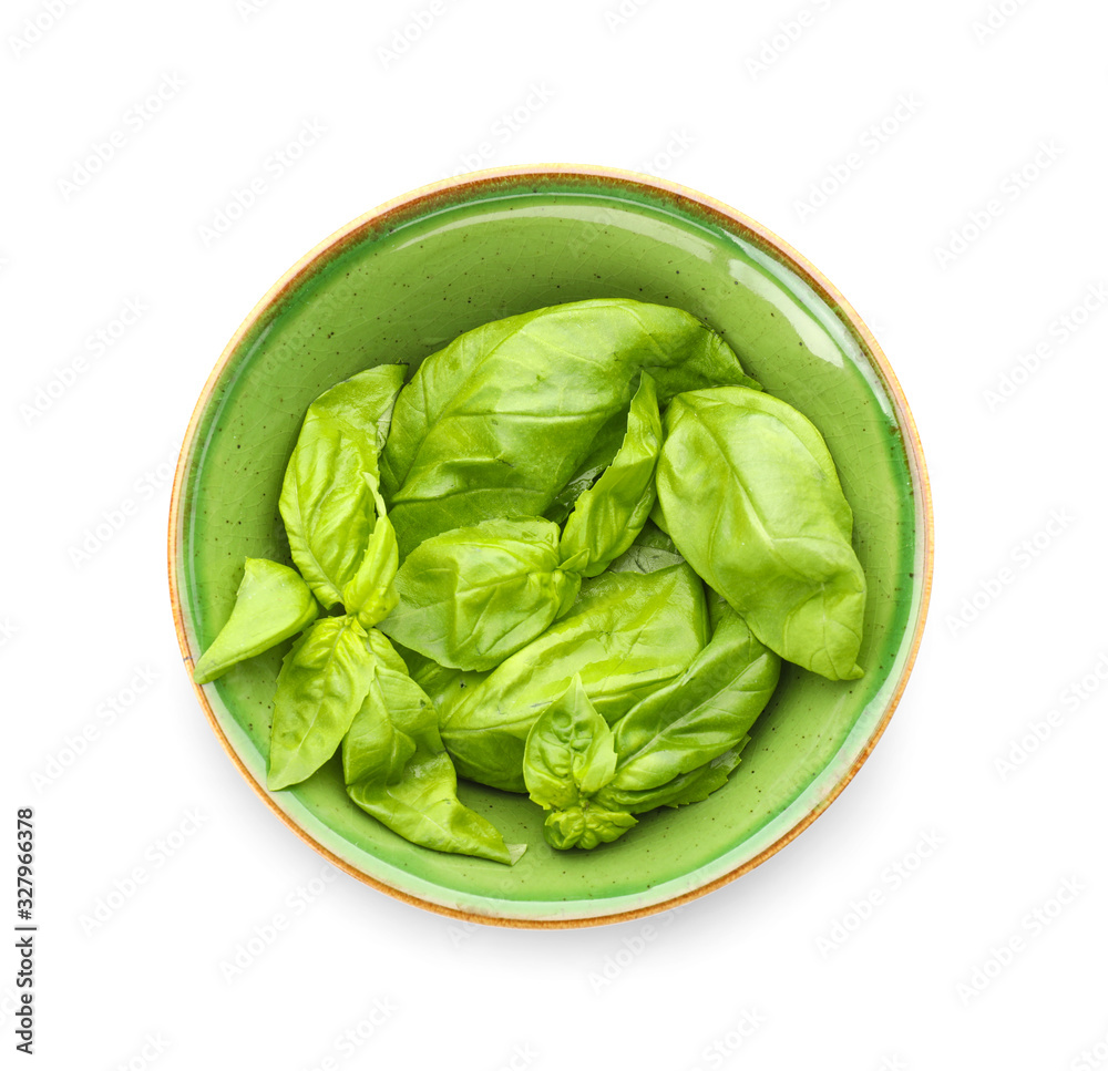 Bowl with fresh basil isolated on white Bowl with fresh basil isolated on white