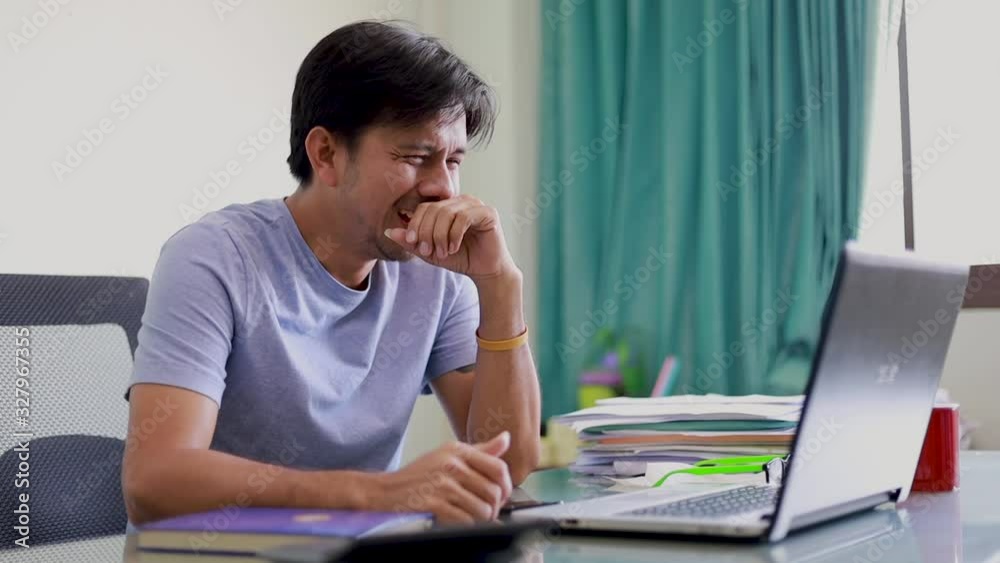Asian office workers laughter and cant stop, funny positive emotions at work At the office desk Asian office workers laughter and cant stop, funny positive emotions at work At the office desk