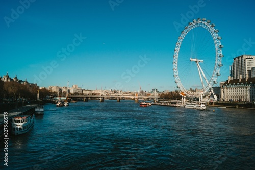 Fotografie, Obraz Wide angle of the London Eye next to the river Thames in the UK