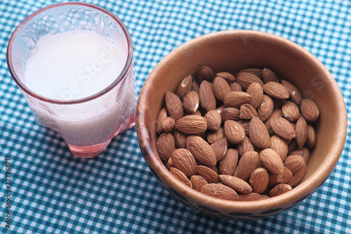 Close up of fresh almond and milk on table 