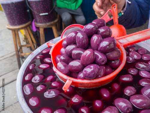 Peruvian olives or Botija olives at a local market photo